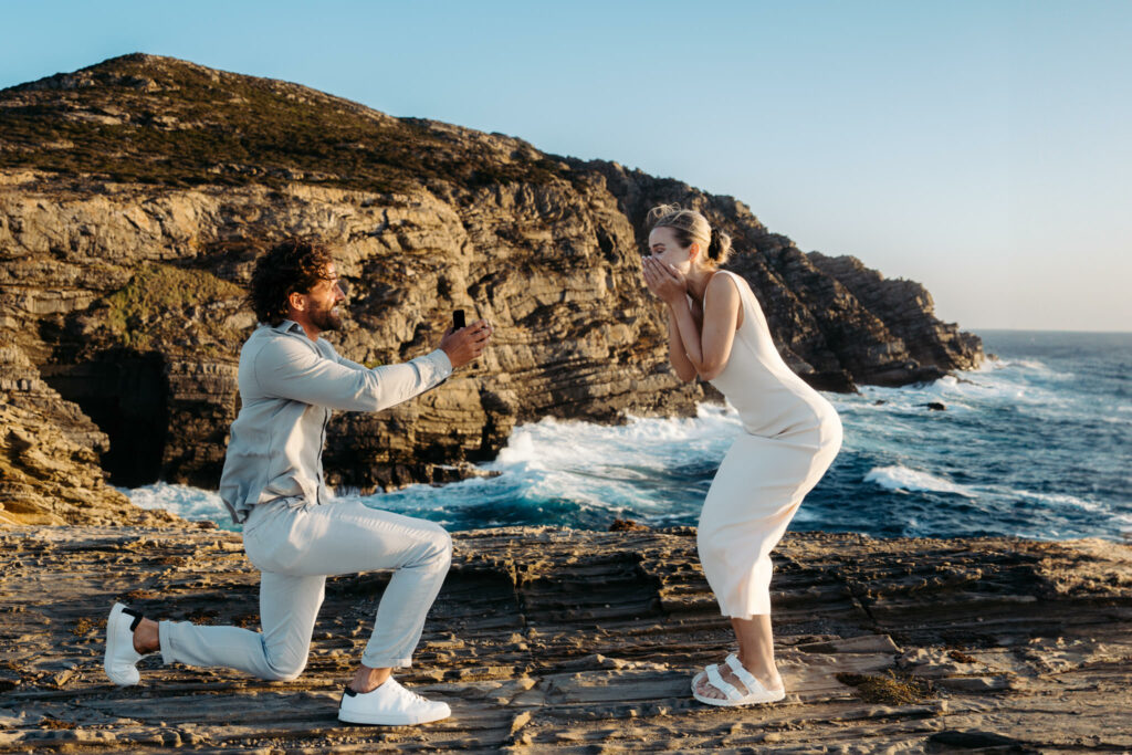 wedding proposal  sardinia rock cliff sunset